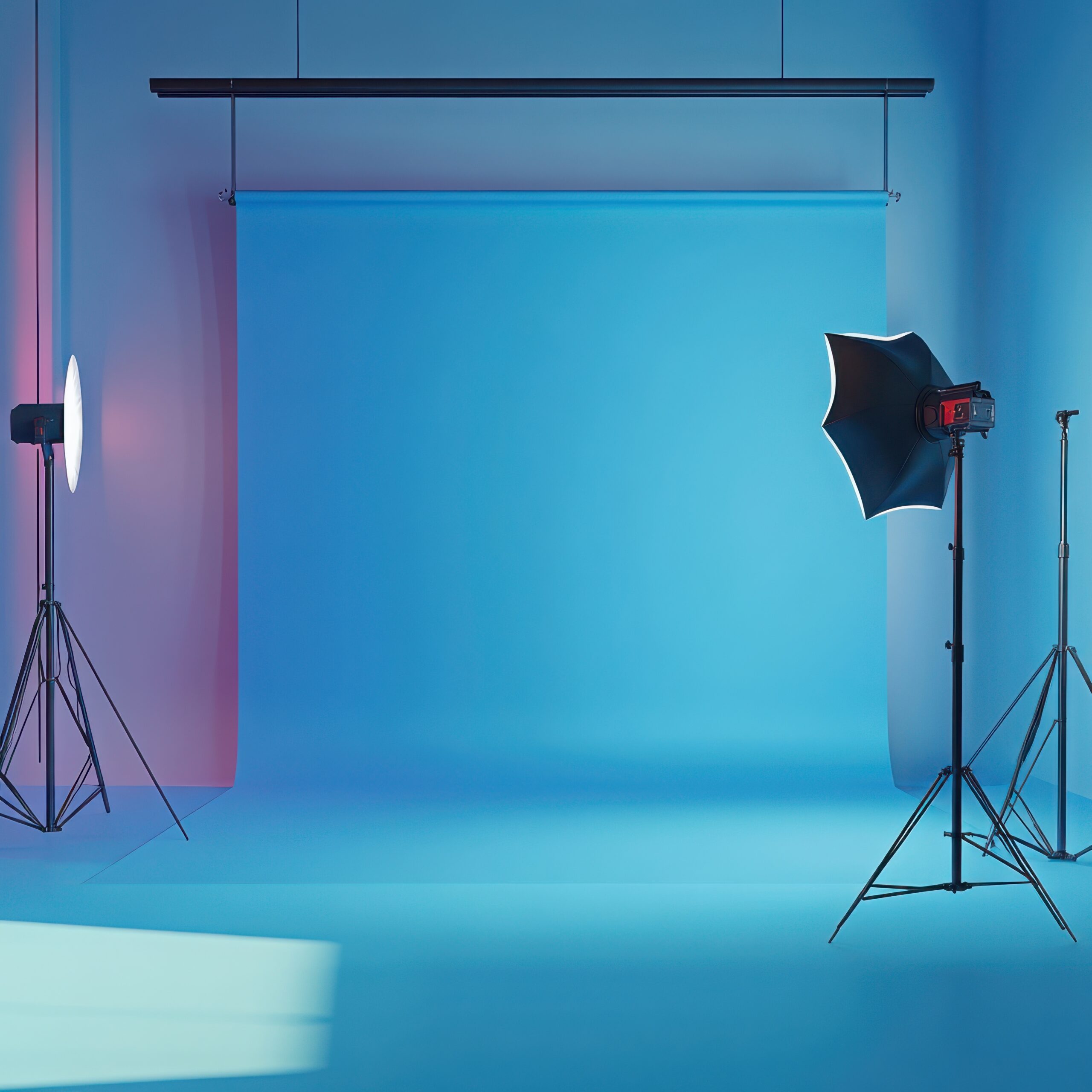 professional photography studio setup with blue backdrop and lighting equipment